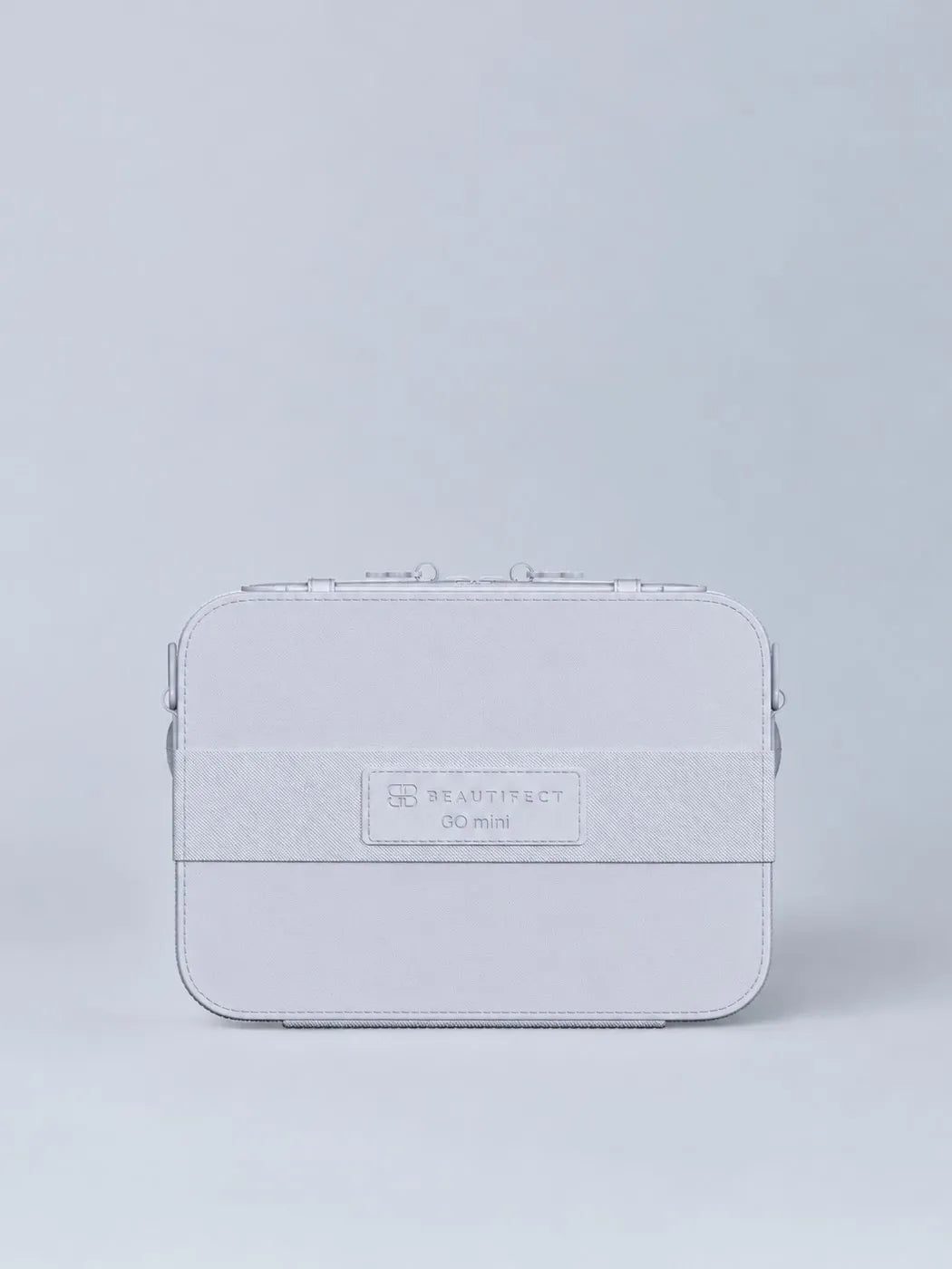 The GO mini Powder Blue seen from the back, with its luggage strap